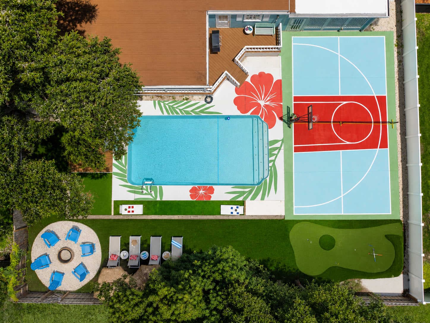An aerial view of a Largo vacation home with a pickleball court and pool